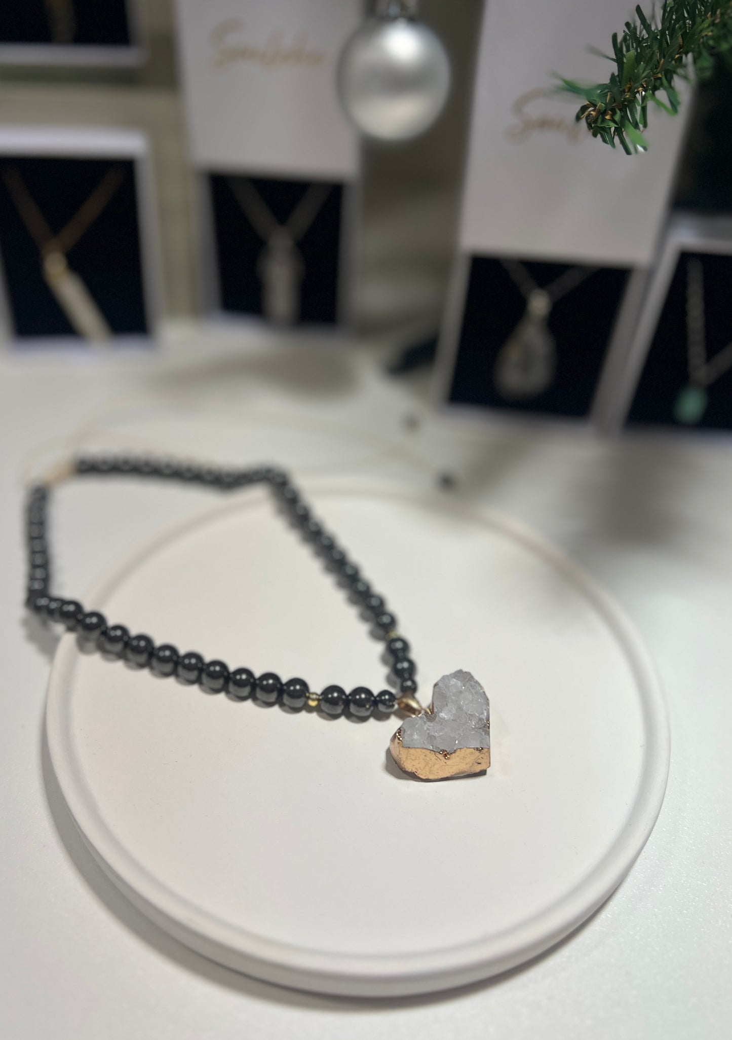 Necklace with a heart-shaped pendant on a white surface