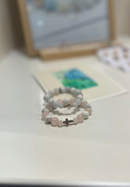 Two beaded bracelets on a light surface with a blurred background