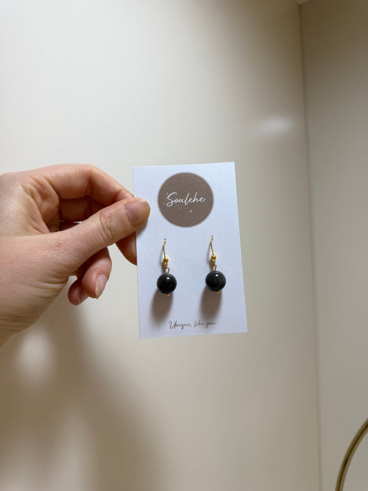 Gold hook earrings with Obsidian beads.